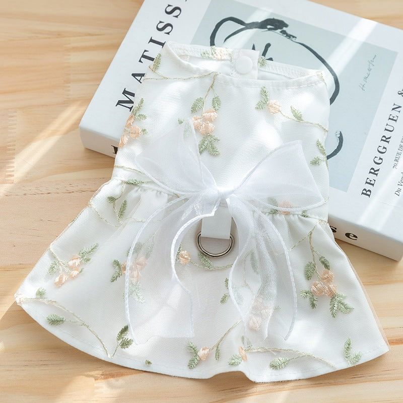 Double-layered princess-style dog skirt, white with floral print, ruffled hem and bow