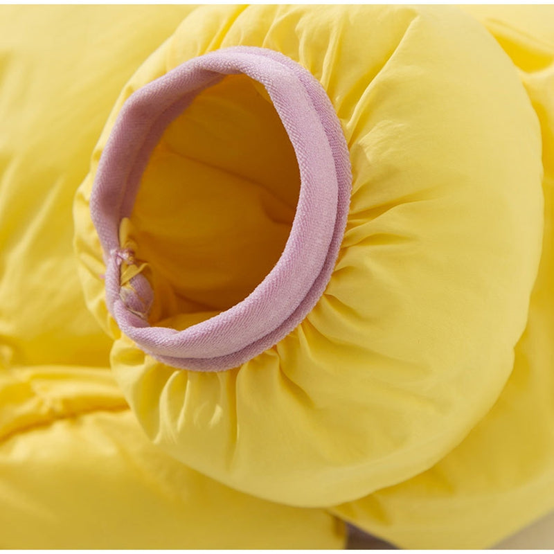 Color-block puffer dog jumpsuit close-up of round leg opening in yellow with lavender trim
