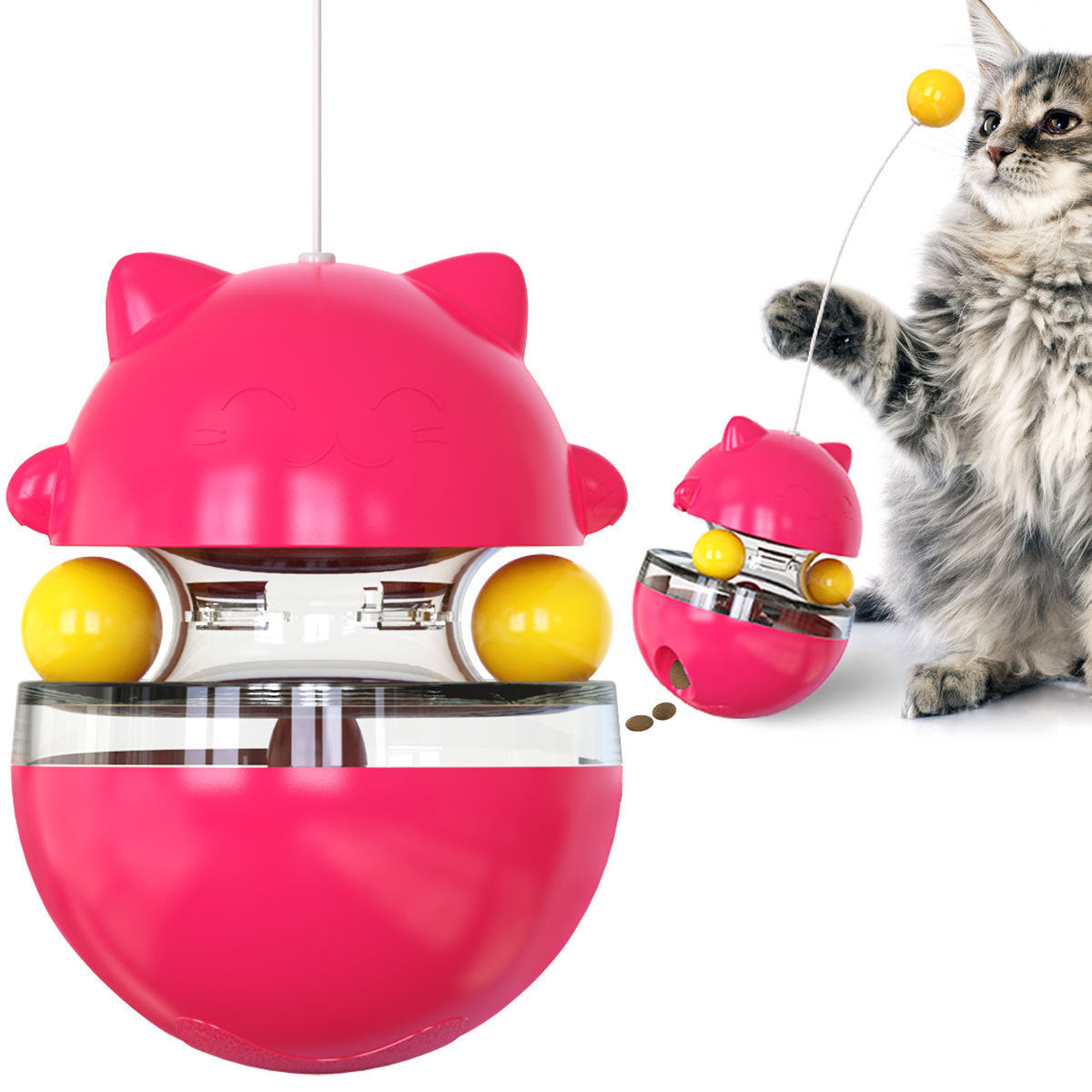 Pink cat treat dispenser toy with clear bowl and yellow balls, shown with gray cat