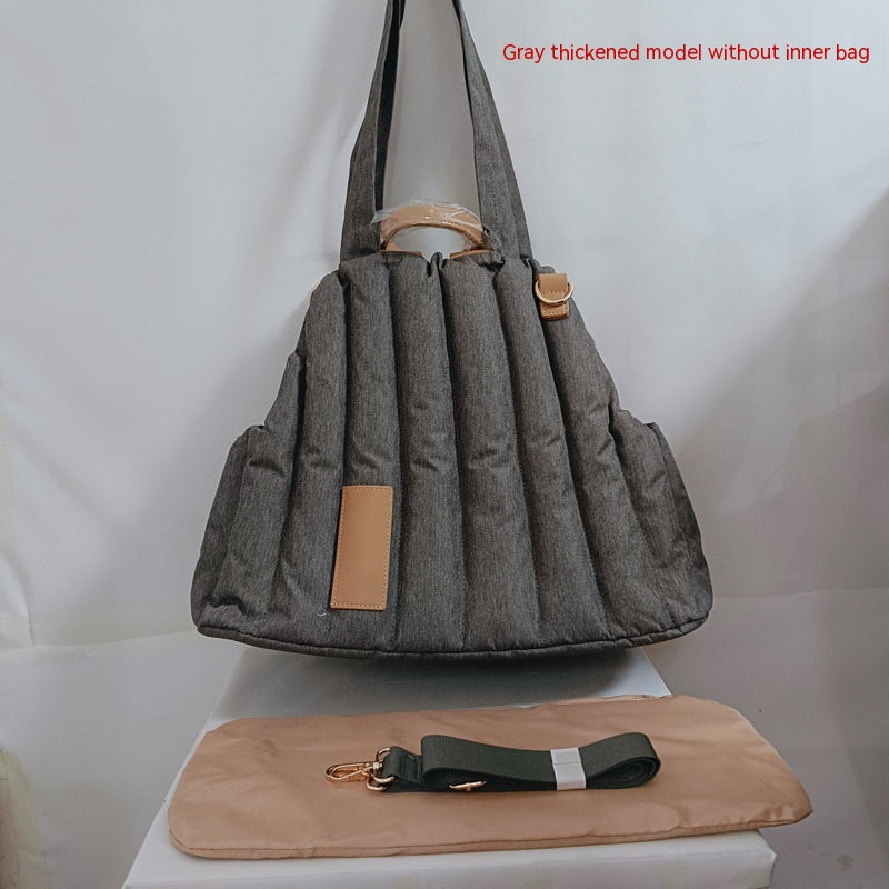 Gray quilted pet shoulder bag with beige fleece lining and front side strap
