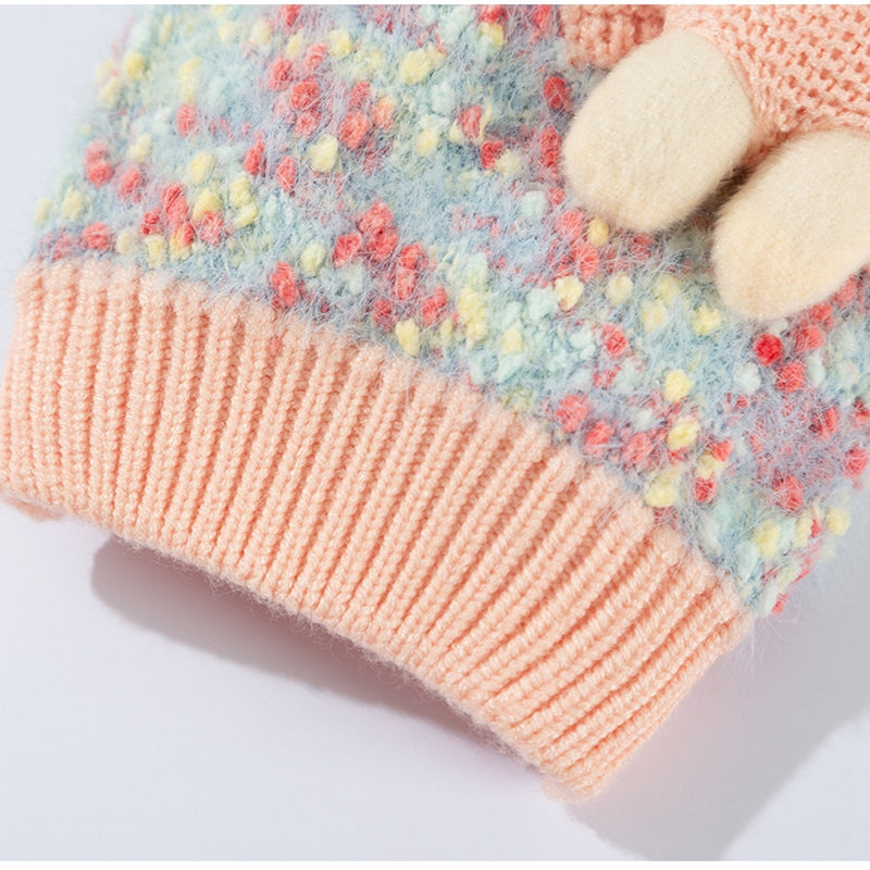 Multicolor knit pet sweater detail with teddy bear pocket and ribbed peach trim