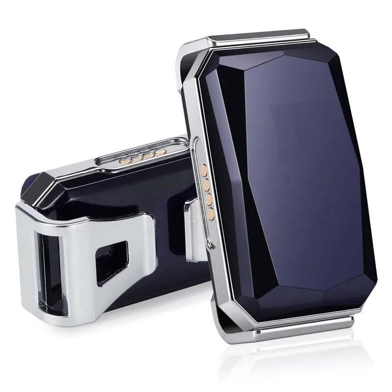 Black GPS tracker module with exposed gold charging contacts on metal housing
