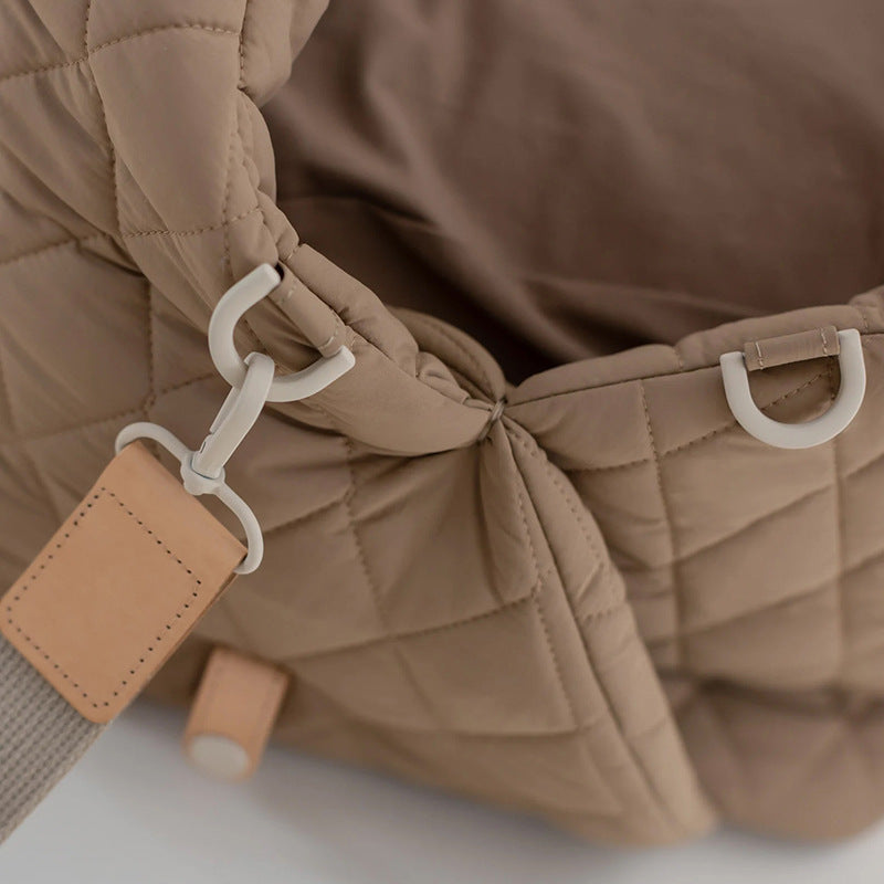 Quilted pet handbag strap with buckles and leather label detail