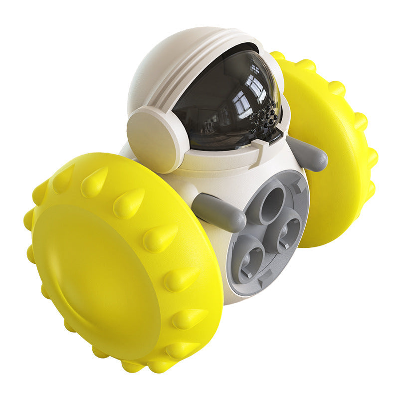 Interactive pet feeding balance car toy with yellow spiked rollers and clear cockpit window