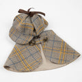 Plaid dog cloak outfit with hood and cape, flat lay detail