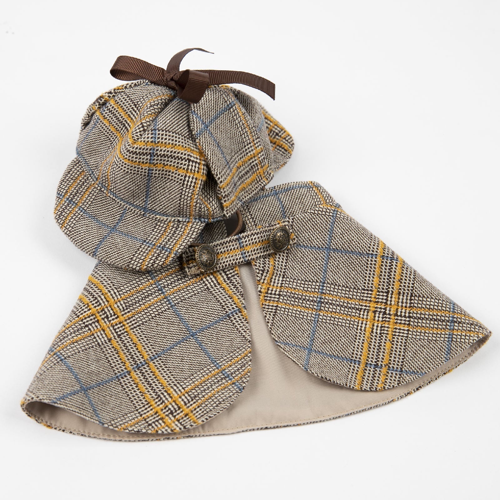 Plaid dog cloak outfit with hood and cape, flat lay detail