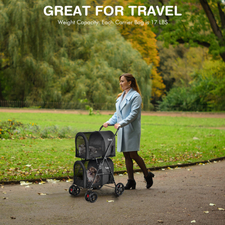 Black double pet stroller with two mesh carrier bags being pushed outdoors