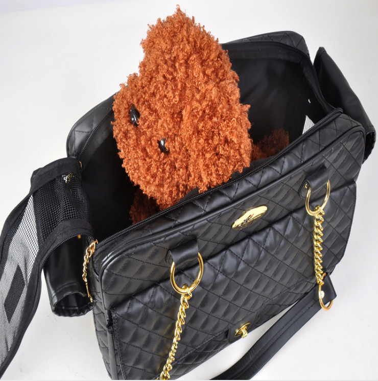 Black quilted pet carrier bag with zipper opening showing small animal inside