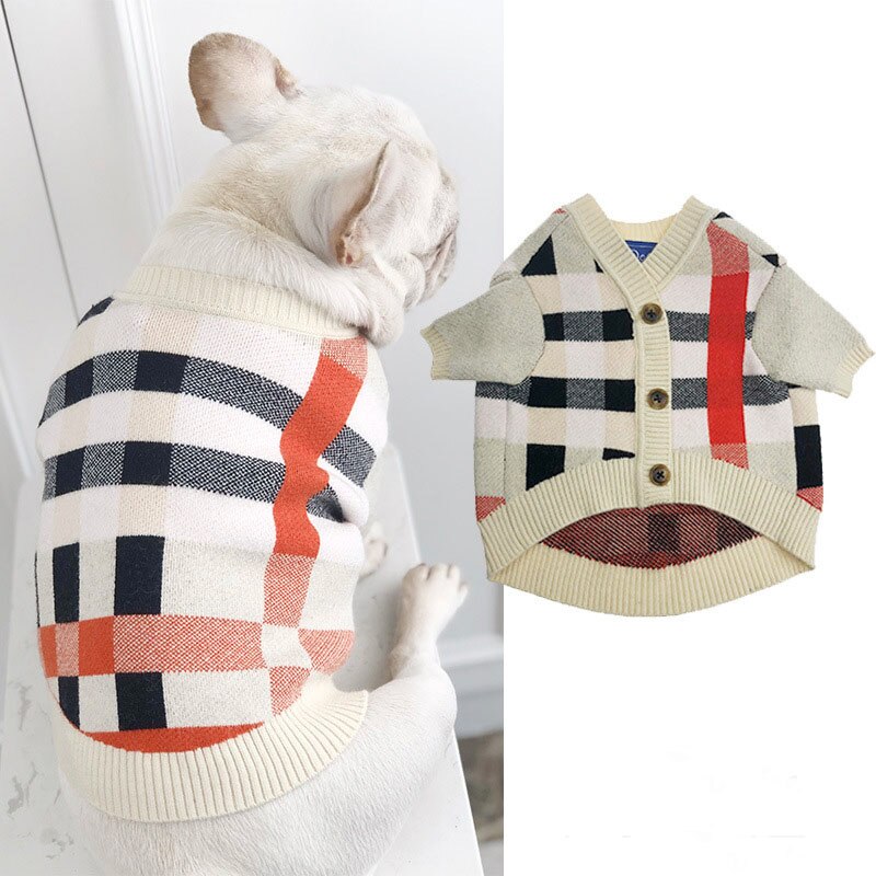 Plaid dog sweater with button front, cream knit with black checks and red stripe detail
