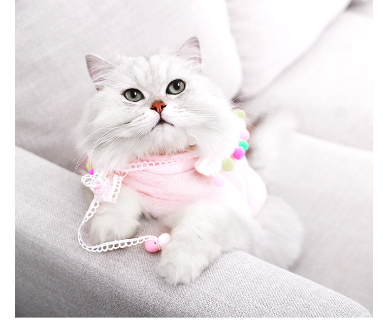 Lightweight pink pet outfit with lace trim and multicolor pom-pom necklace