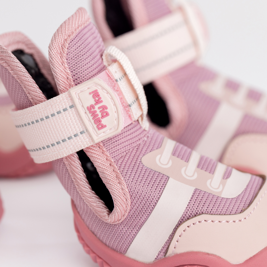 Pink dog sneaker with woven upper and adjustable hook-and-loop strap detail