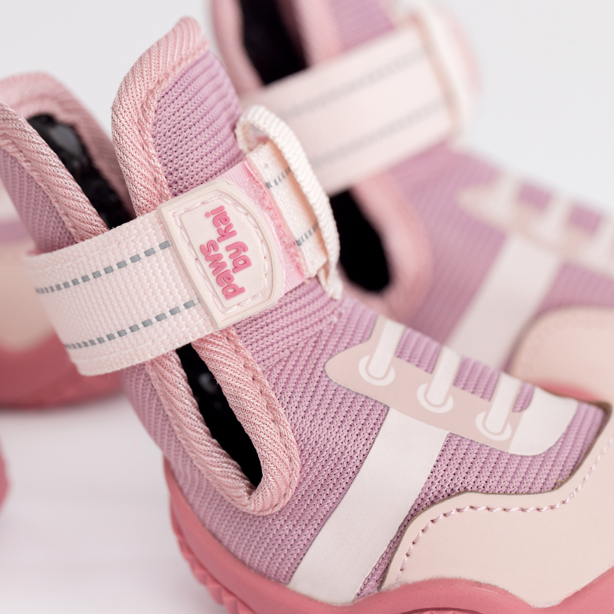 Pink dog sneaker with woven upper and adjustable hook-and-loop strap detail