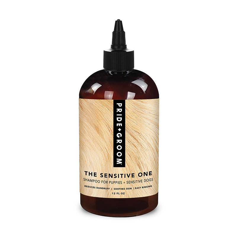 Dog shampoo bottle, amber-brown with black dropper cap and beige vertical label