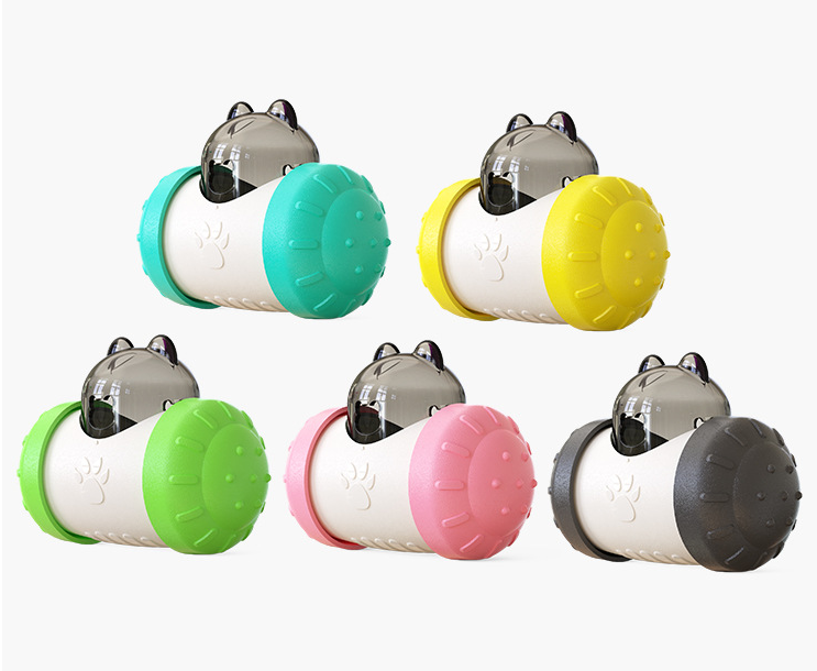 Assorted treat-dispensing wheel dog toys in teal, yellow, green, pink, and gray