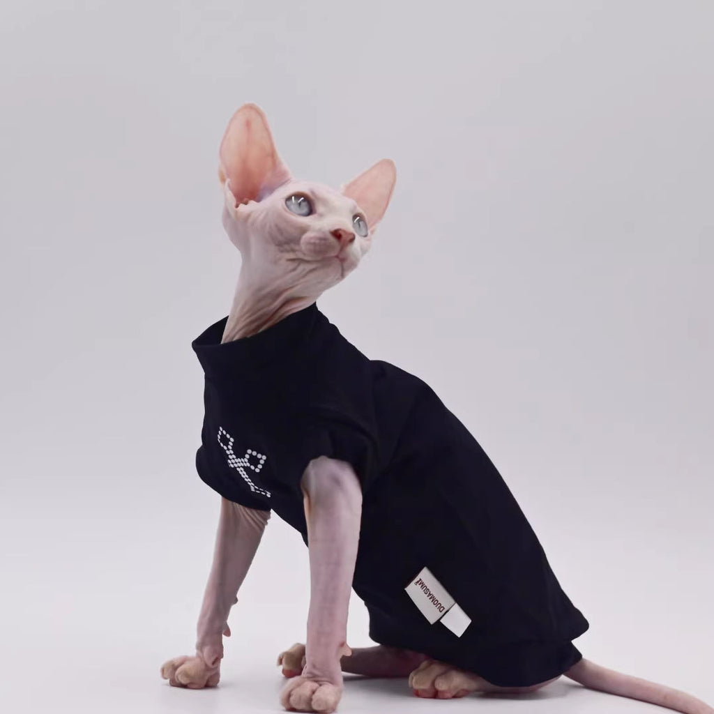 Black cat vest with side fabric label patch and cross gemstone-style logo