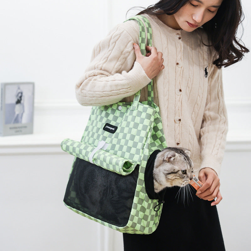 Small portable cat shoulder bag with green check pattern and black front panel.