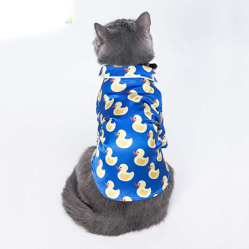 Blue duck-print pet jacket shown from the back with short sleeves