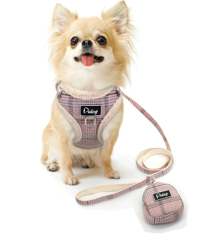 Plaid plush dog harness with matching leash and small accessory pouch on a small pet.