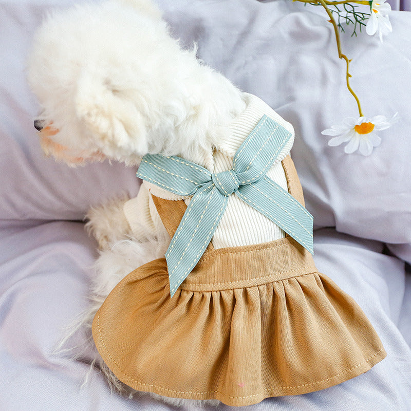Dog and cat dress with light-blue neck bow, khaki skirt, white knit top