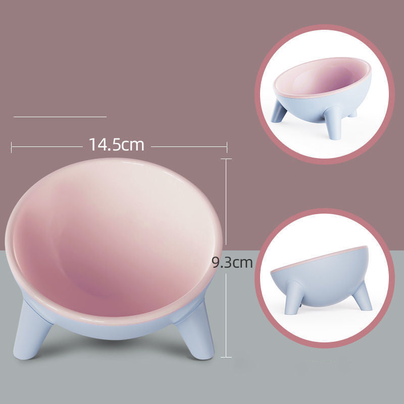 Light pink pet feeding bowl with blue legs and pale pink inner bowl