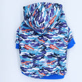 Blue camouflage pet hoodie with hood, multicolor logo print and blue ribbed cuffs.