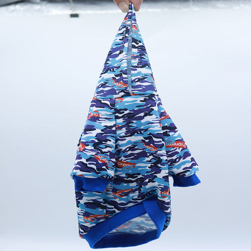 Blue camo hooded pet hoodie with ribbed cuffs and printed logo pattern, side view