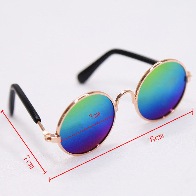 Round rainbow-tinted sunglasses with rose-gold frame and black temples