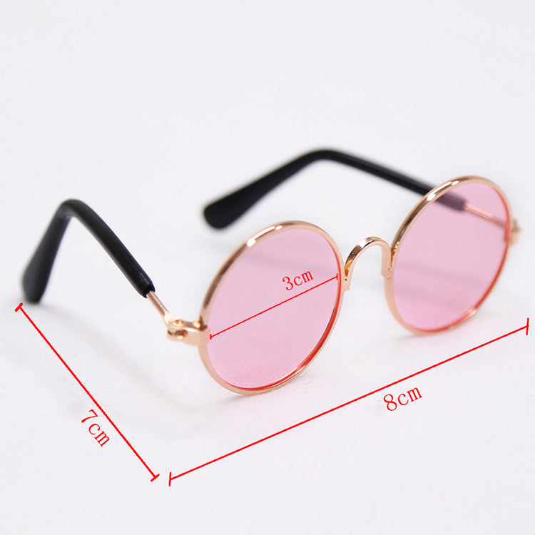 Round pet glasses with pink lenses, gold-tone frame, black temple arms