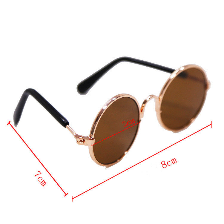 Round brown-tinted sunglasses with black temples and rose-gold frame