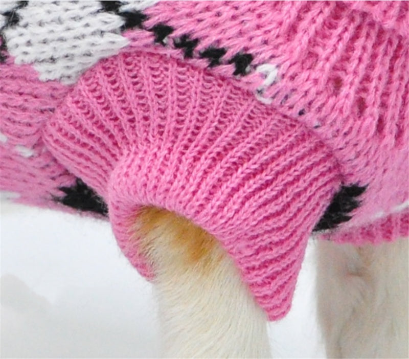 Pink ribbed knit pet sweater with black-and-white patterned trim