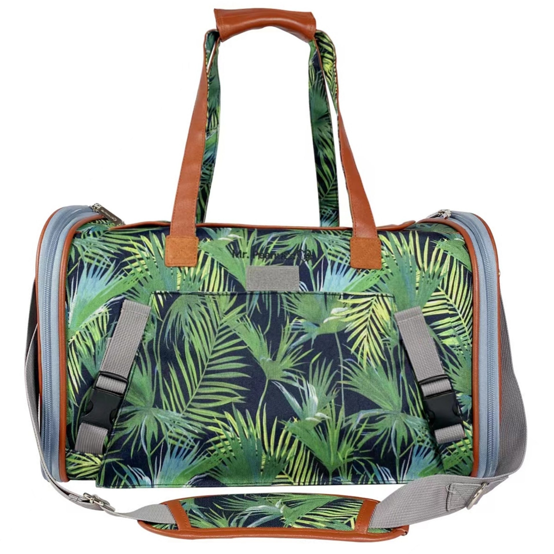 Expandable pet carrier with tropical palm-print fabric and padded front carrying handle.