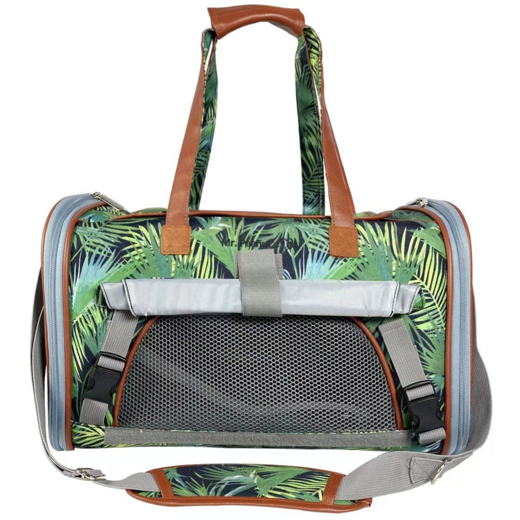 Expandable pet carrier with tropical palm-print body and front mesh ventilation panel.