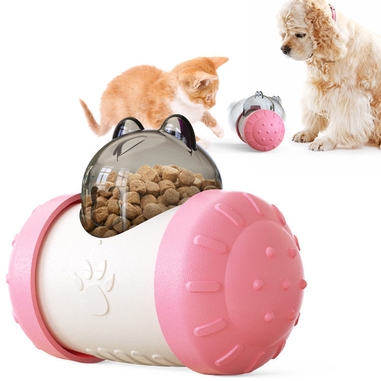 Interactive treat-dispensing wheel toy with clear top and pink-and-white ball body
