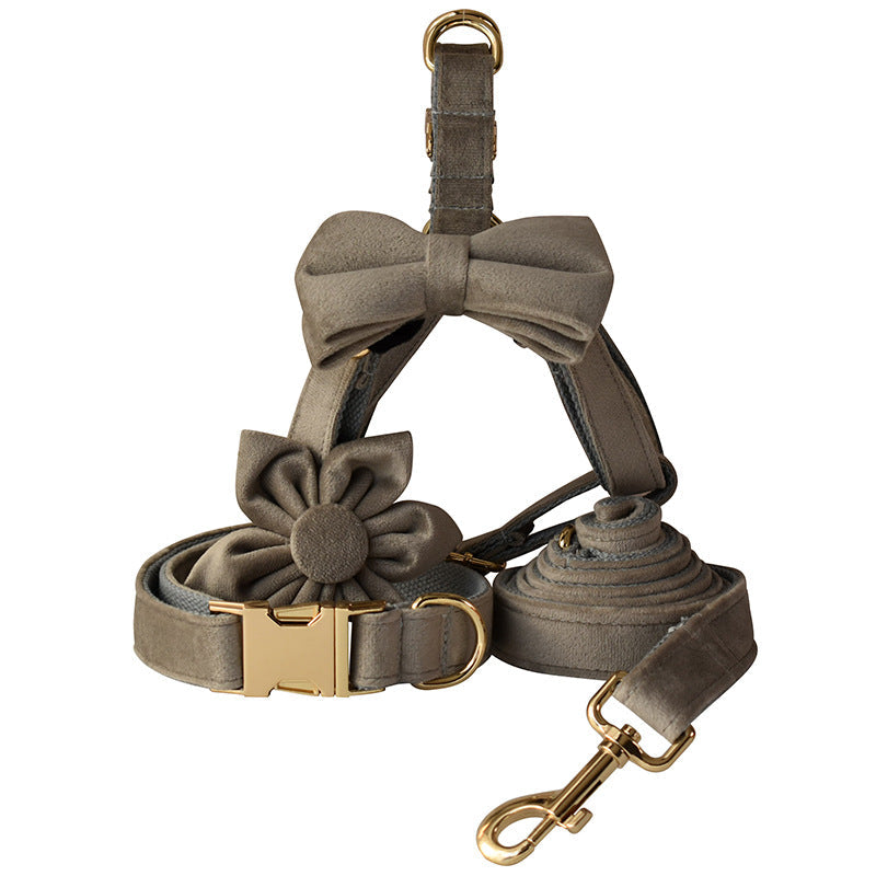 Pet flannel chest strap with gold buckle, bow and flower accents, plus leash clasp