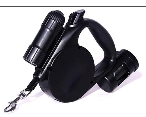 Black retractable dog leash with LED flashlight and waste bag dispenser, retractable cord