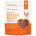 Freeze-dried chicken heart pet treats in orange resealable pouch, dark brown pieces