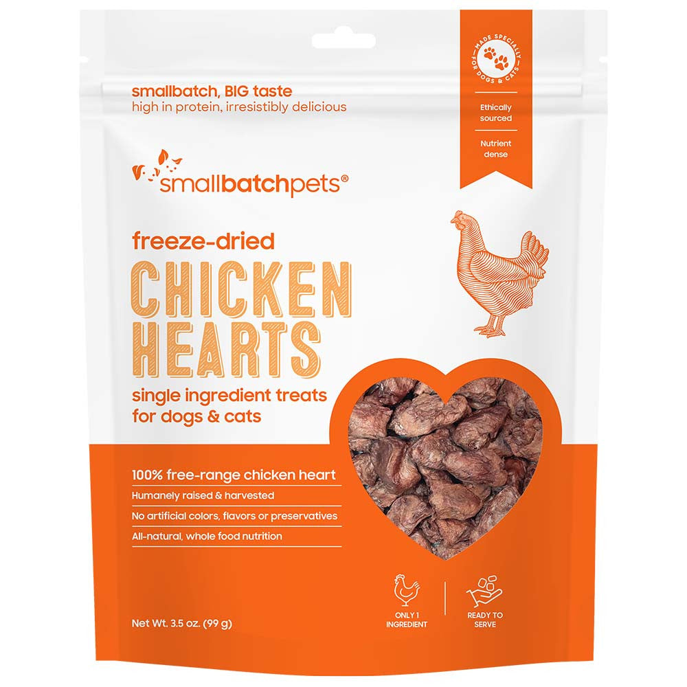 Freeze-dried chicken heart pet treats in orange resealable pouch, dark brown pieces