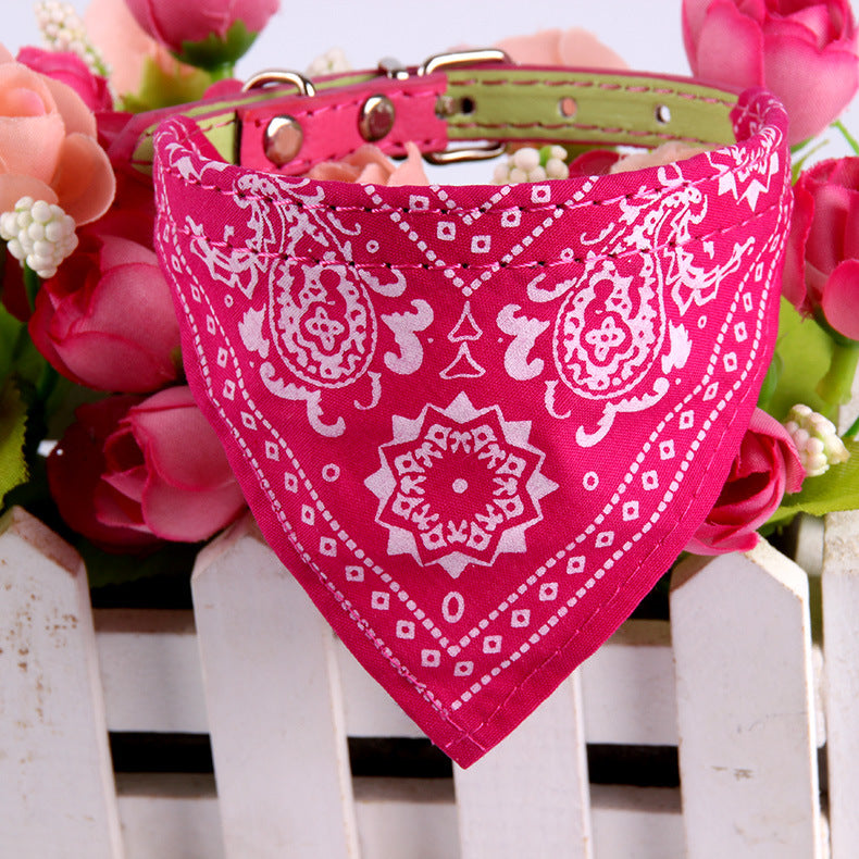 Pink pet bandana with white paisley pattern and snap collar