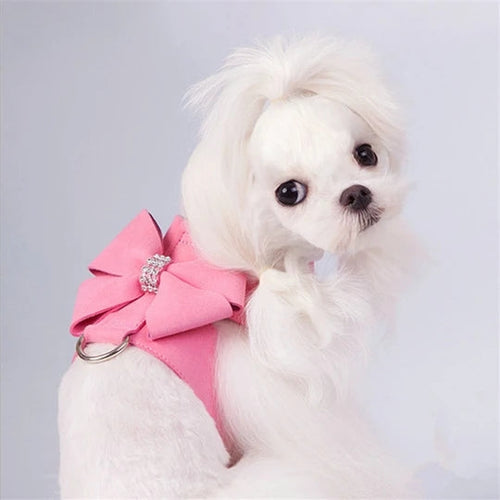 Pink bow dog harness with rhinestone detail and metal leash ring
