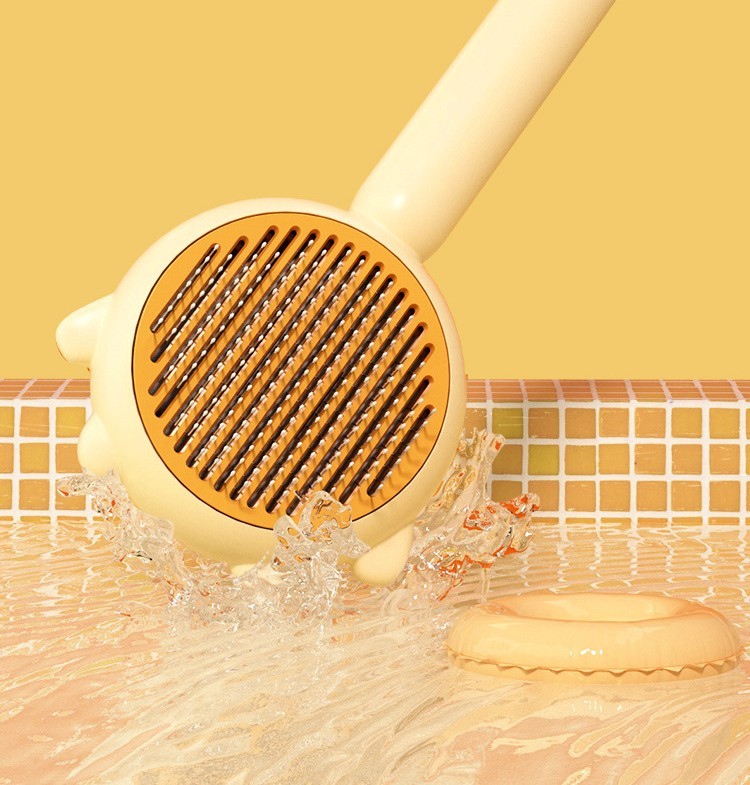 Pet grooming brush with amber-brown bristle oval head splashing in water