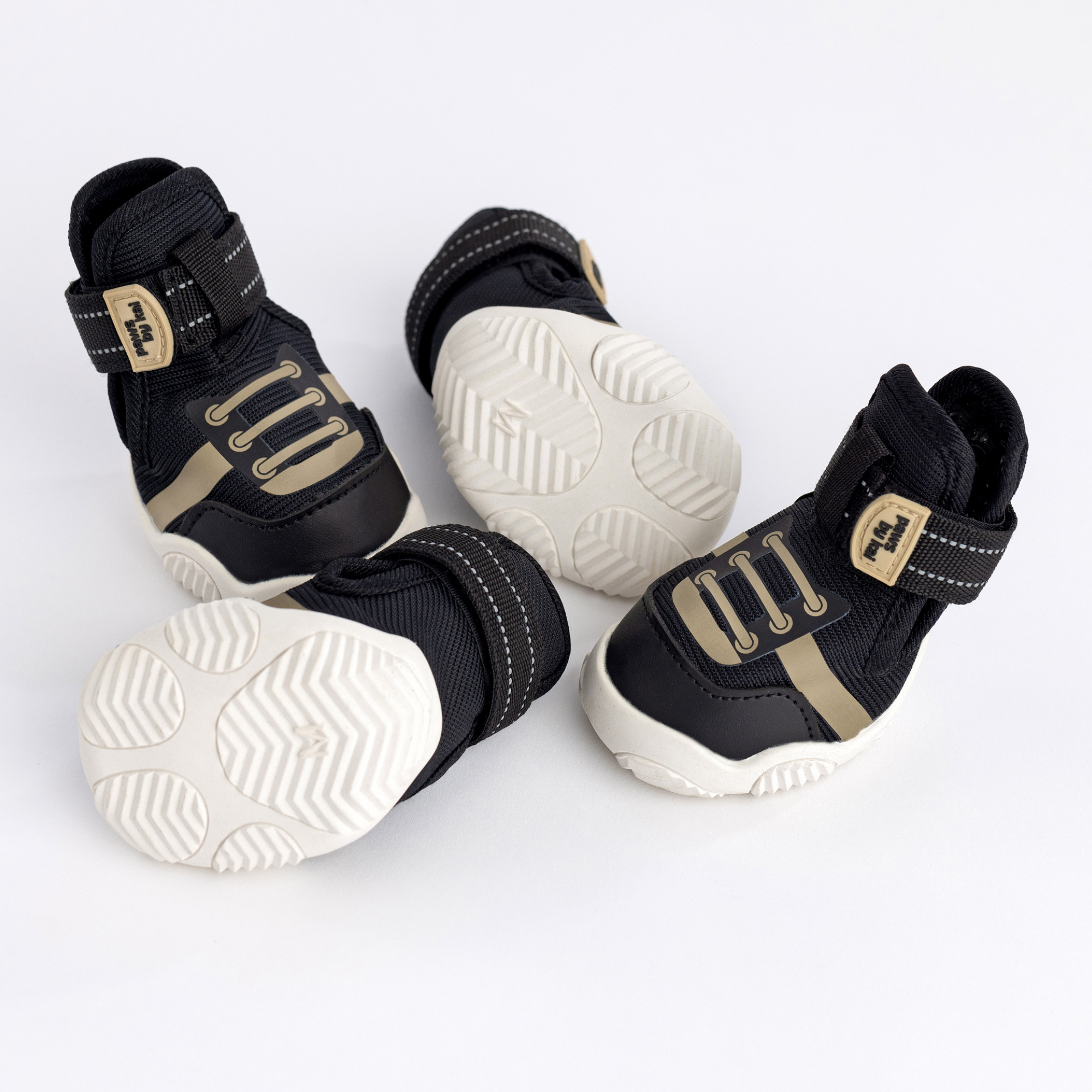 Kai- Dog sneakers in black showing treaded white outsole and Velcro straps