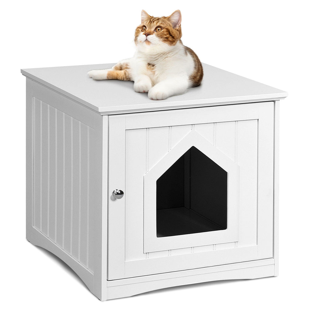 White cat house side table with cat resting on top and enclosed front house opening