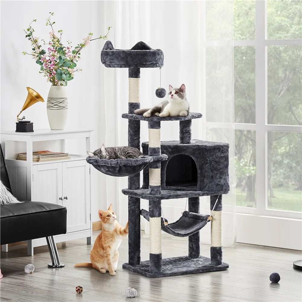 Dark gray cat tree tower with top perch, cubby, and hammock; cats resting on levels