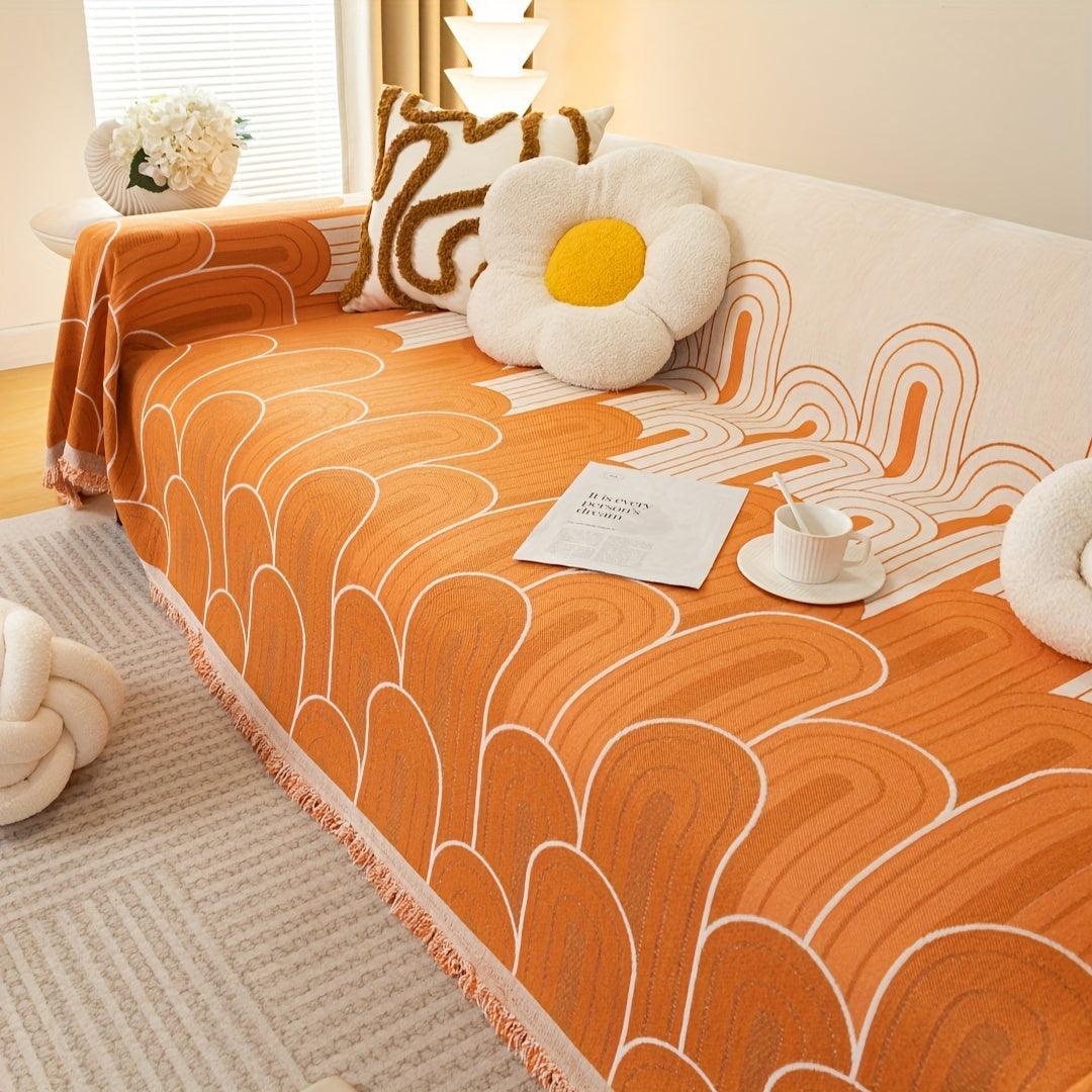 Pet sofa cover in orange with white arch-line pattern and fringed edge