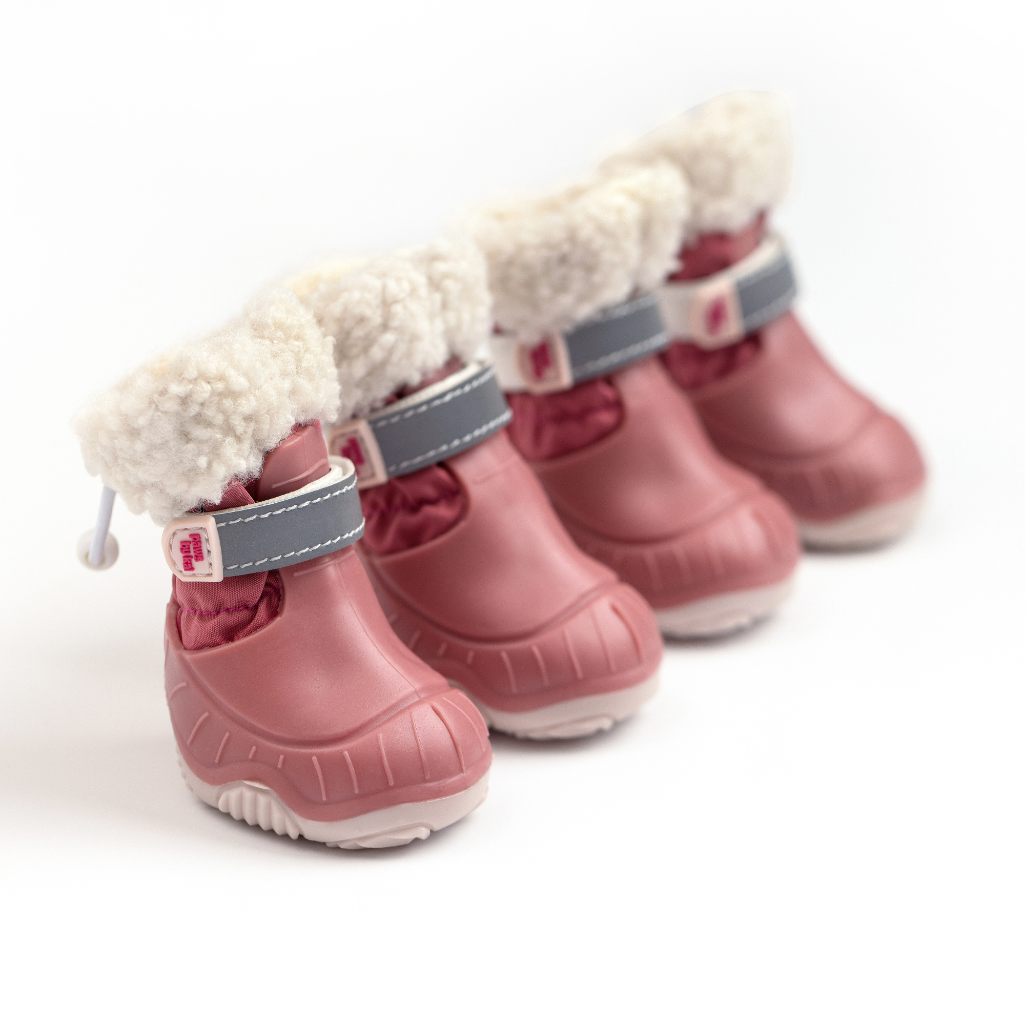Pink dog snow boots pair with faux-fur cuff, blue strap, and ridged outsole