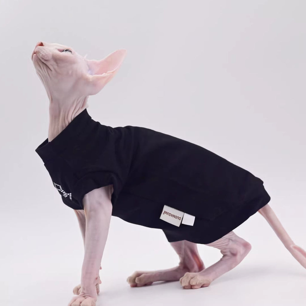 Black cat vest with cross logo and white tag patch at side hem