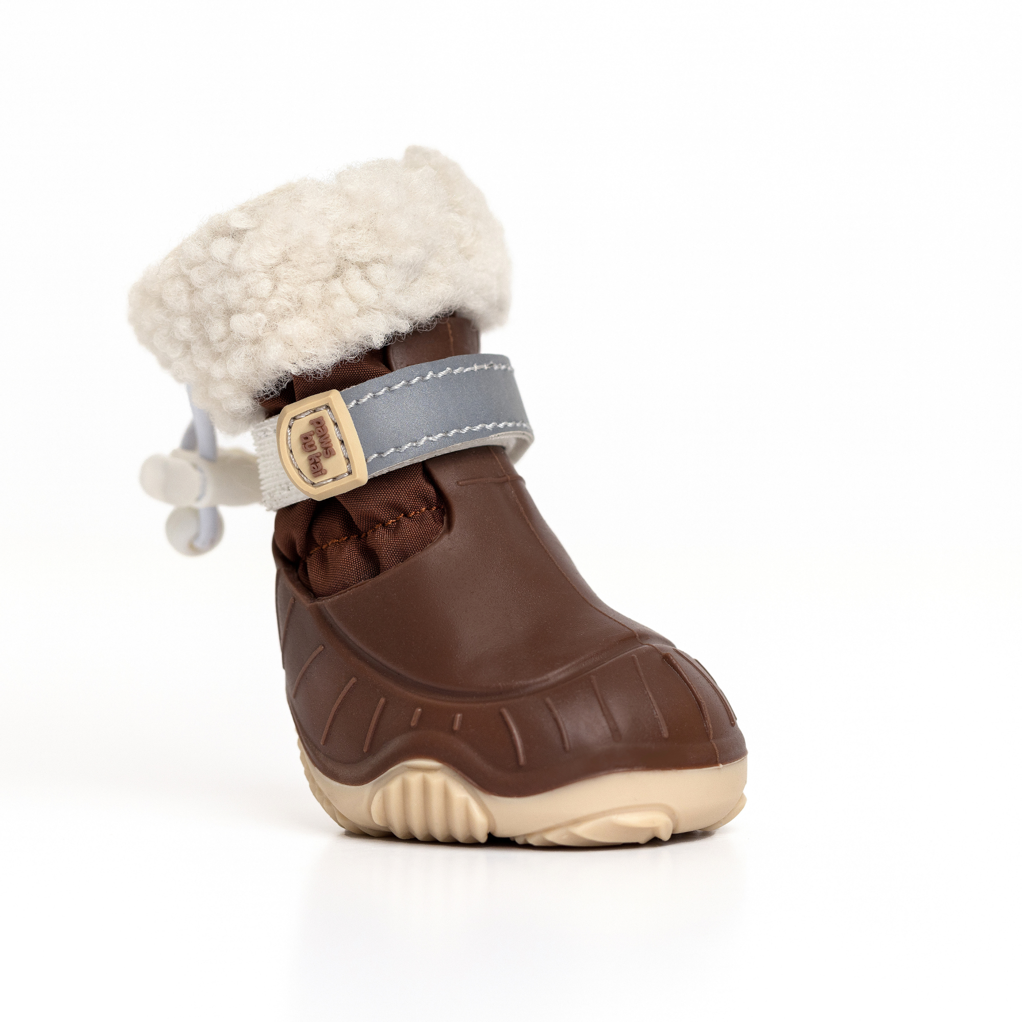 Brown dog snow boot with faux-fur cuff, blue strap, and ribbed rubber outsole
