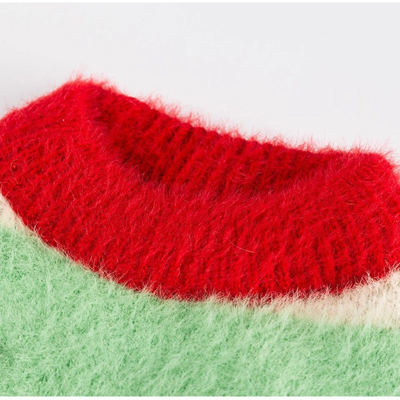 Striped knit fabric section, red upper with green lower and fuzzy texture