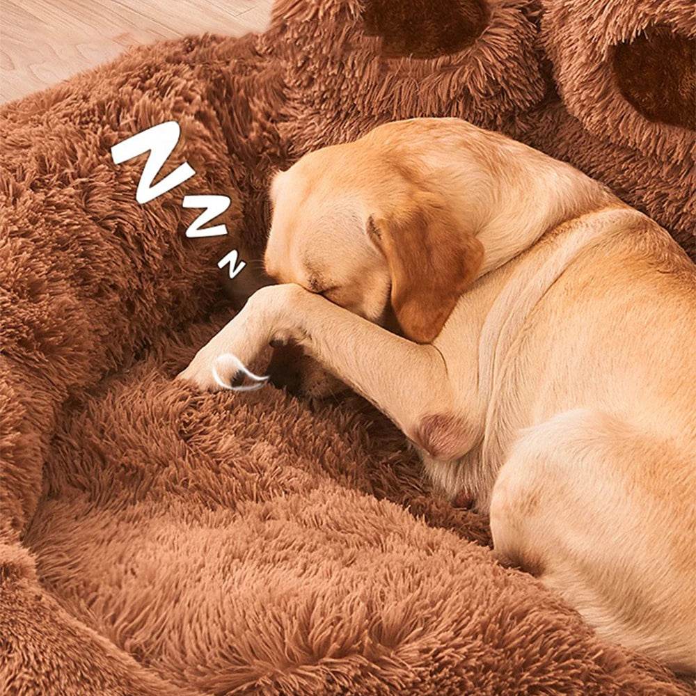 Brown shag plush pet bed with curled dog sleeping in raised paw bolsters