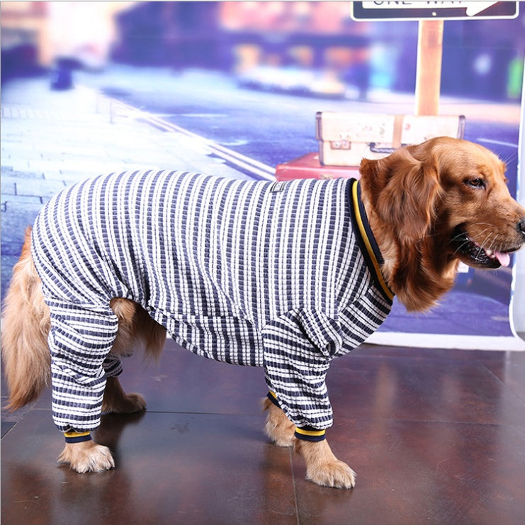 Striped dog sweater with navy and white stripes and yellow collar trim, standing side view